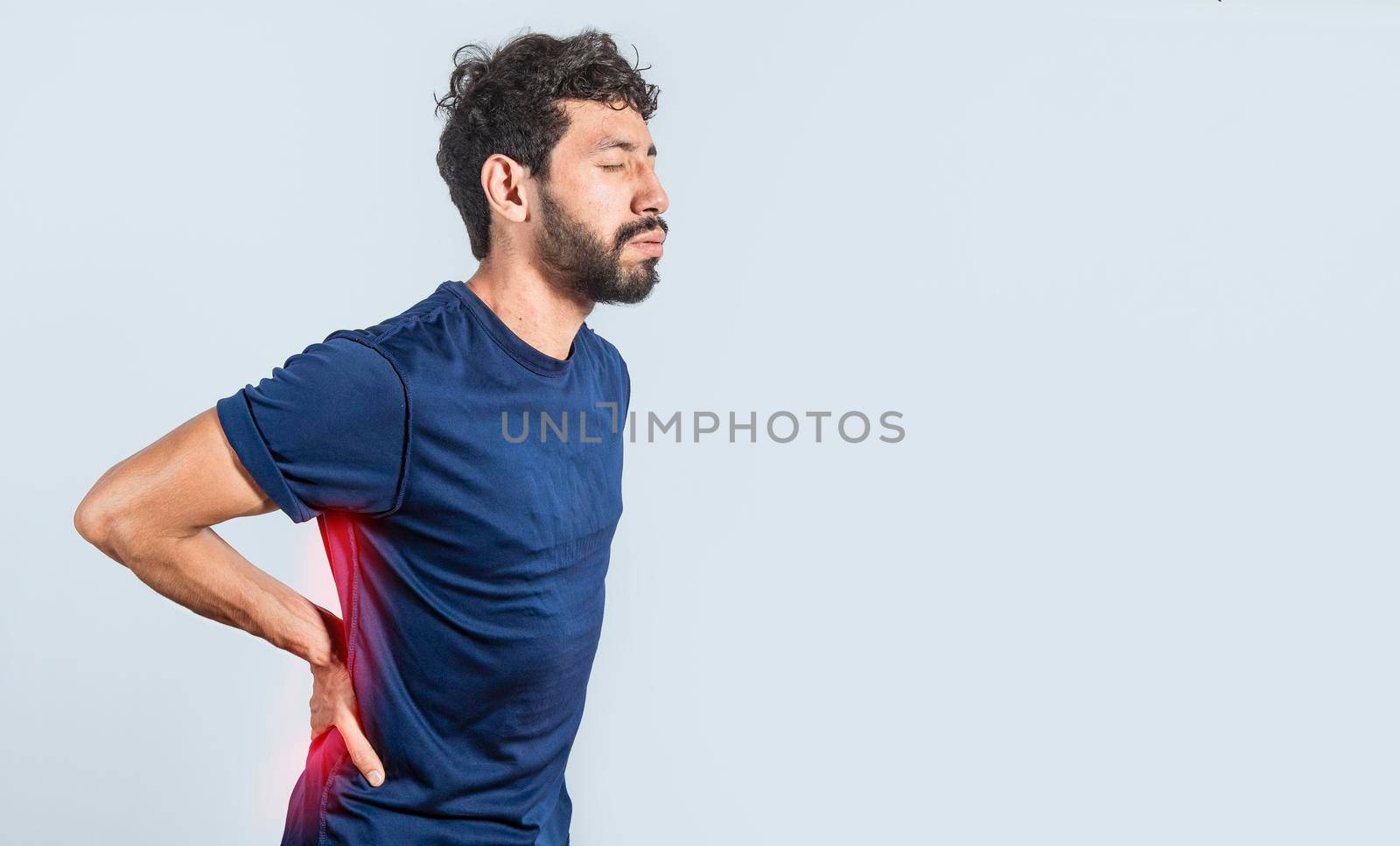 Man with spine problems, person with back problems on isolated background, lumbar problems concept, a sore man with back pain