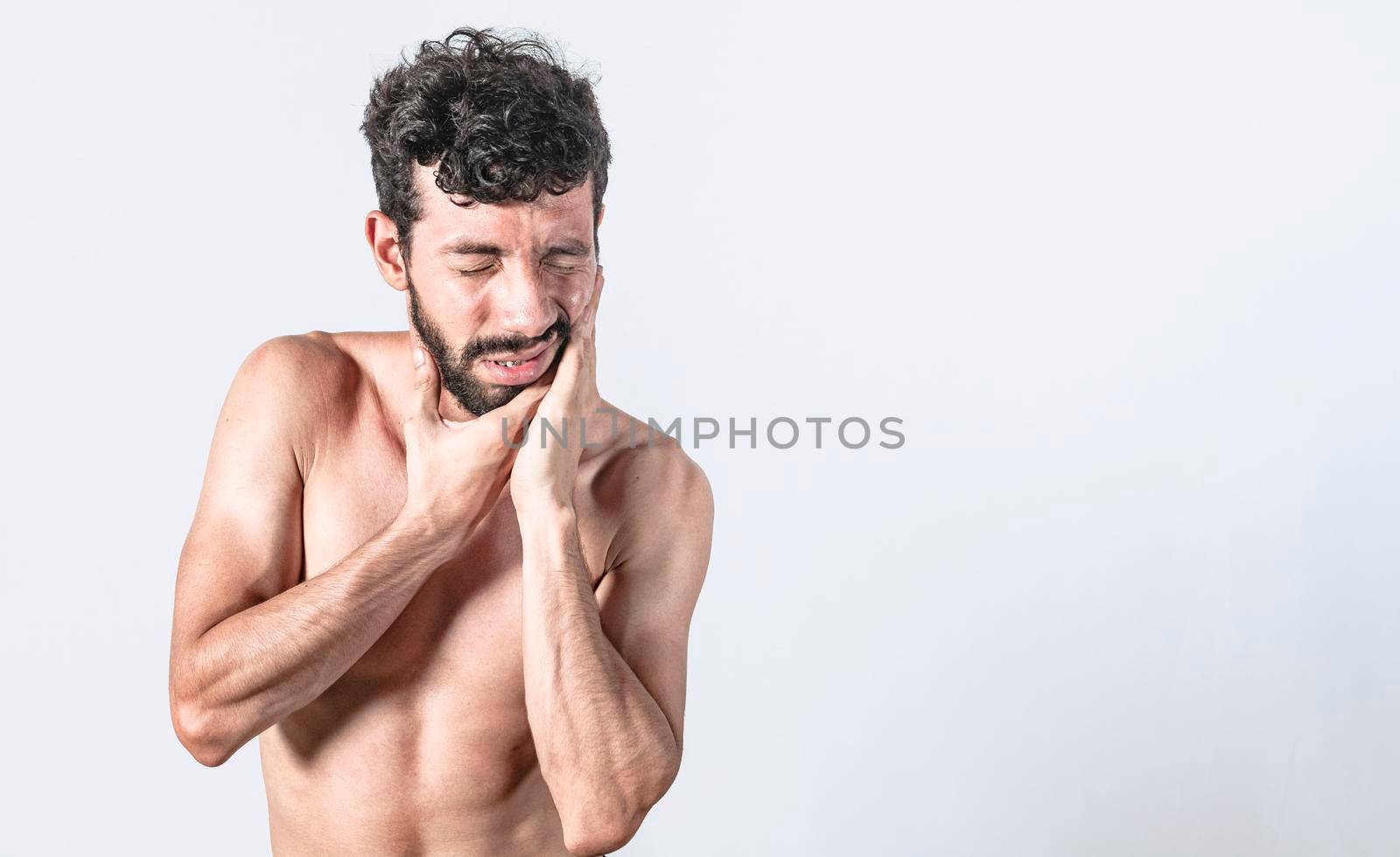 Man with earache on isolated background, ear disease concept, Person with earache on isolated background