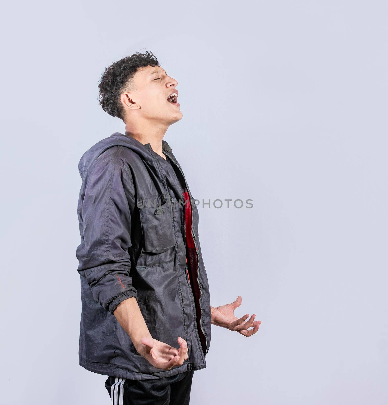 Guy screaming loud, isolated space, desperate man yelling on isolated background, frustrated young man yelling on white background