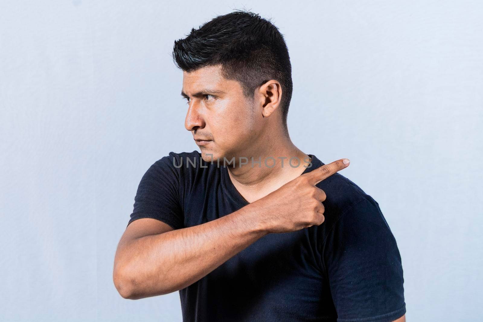 Angry person pointing to get out, Get out, annoyed bearded man looking to the side and pointing finger, angry man pointing to get out