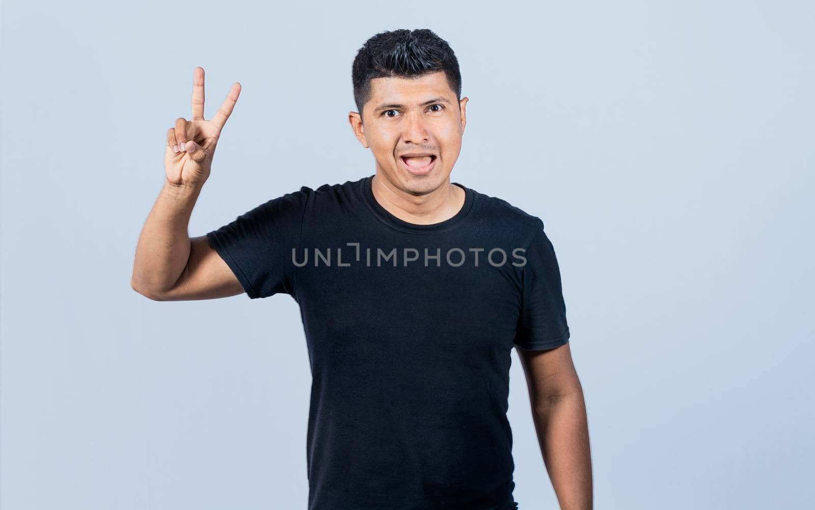 Smiling people showing ok gesture looking at camera, Person gesturing everything is ok, young man making ok gesture, expression of everything is fine.