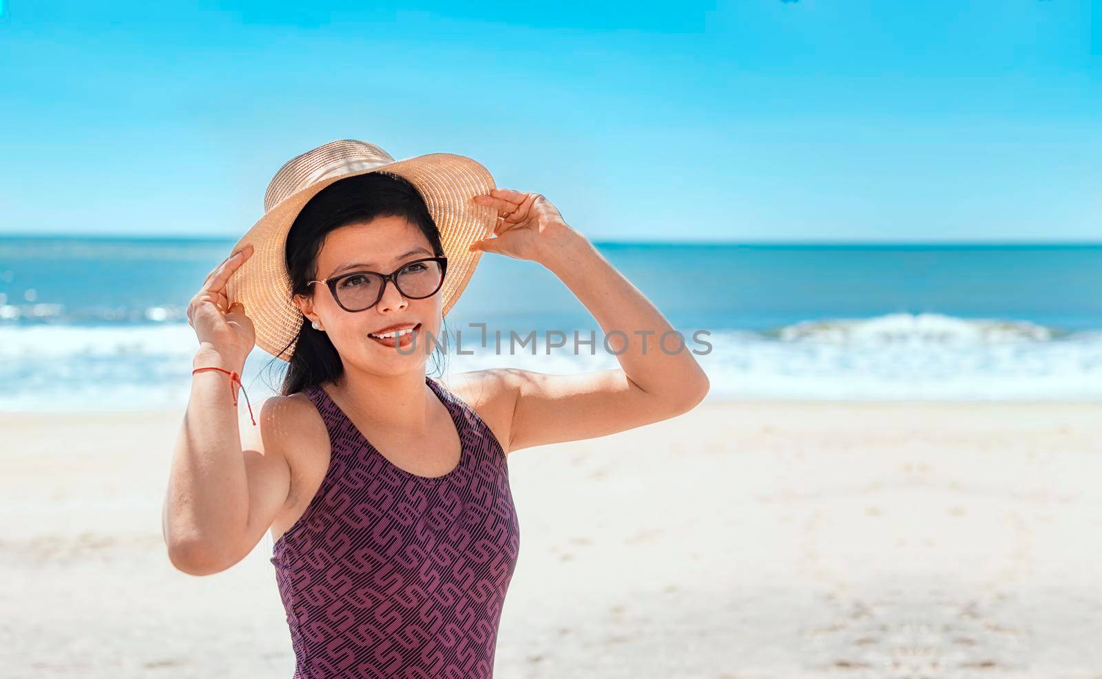 woman in hat happy on the beach, happy pretty young woman on vacation, vacation concept
