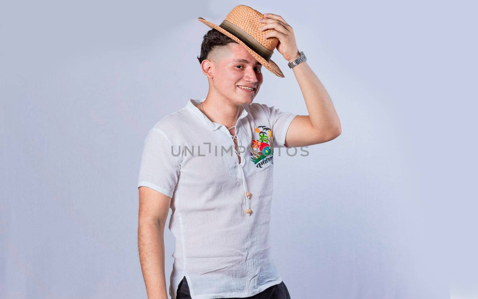 Man with hat and beach shirt on isolated background, concept of a man with hat and beach shirt