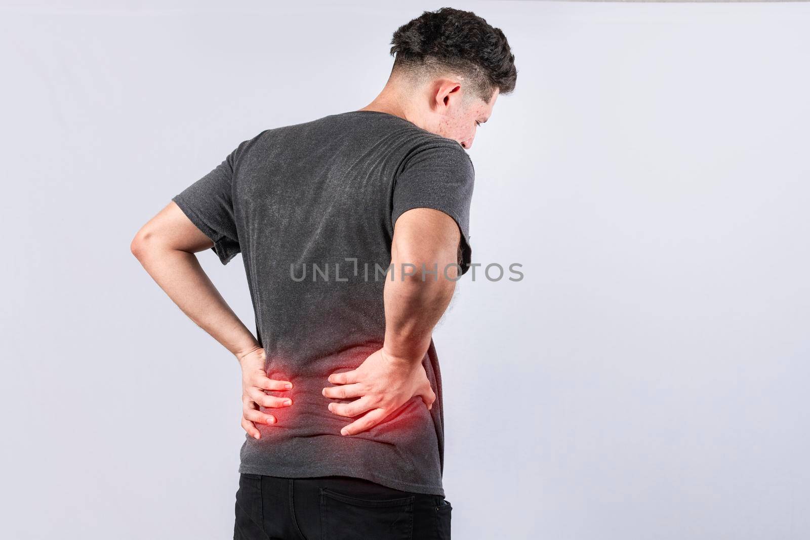 Man with spine problems, person with back problems on isolated background, lumbar problems concept, a sore man with back pain