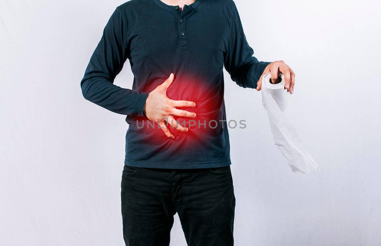 Man with stomach problems holding toilet paper, Person with toilet paper with stomach problems on isolated background, Concept of a person with digestive and diarrhea problems