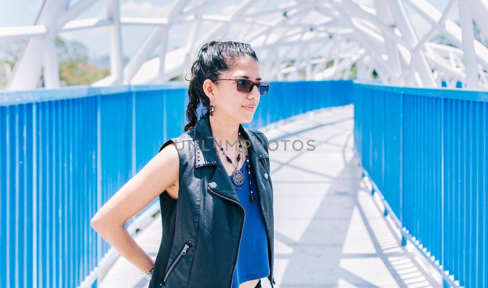 Portrait of urban girl on a bridge, portrait of an attractive girl on a bridge, Lifestyle of attractive urban girl on a bridge, concept of a lifestyle girl by isaiphoto