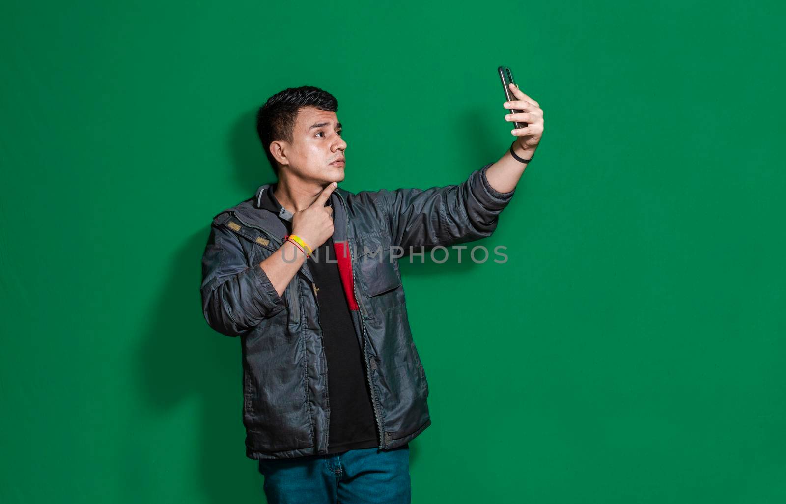 Guy taking photo isolated, man taking some selfie with isolated background