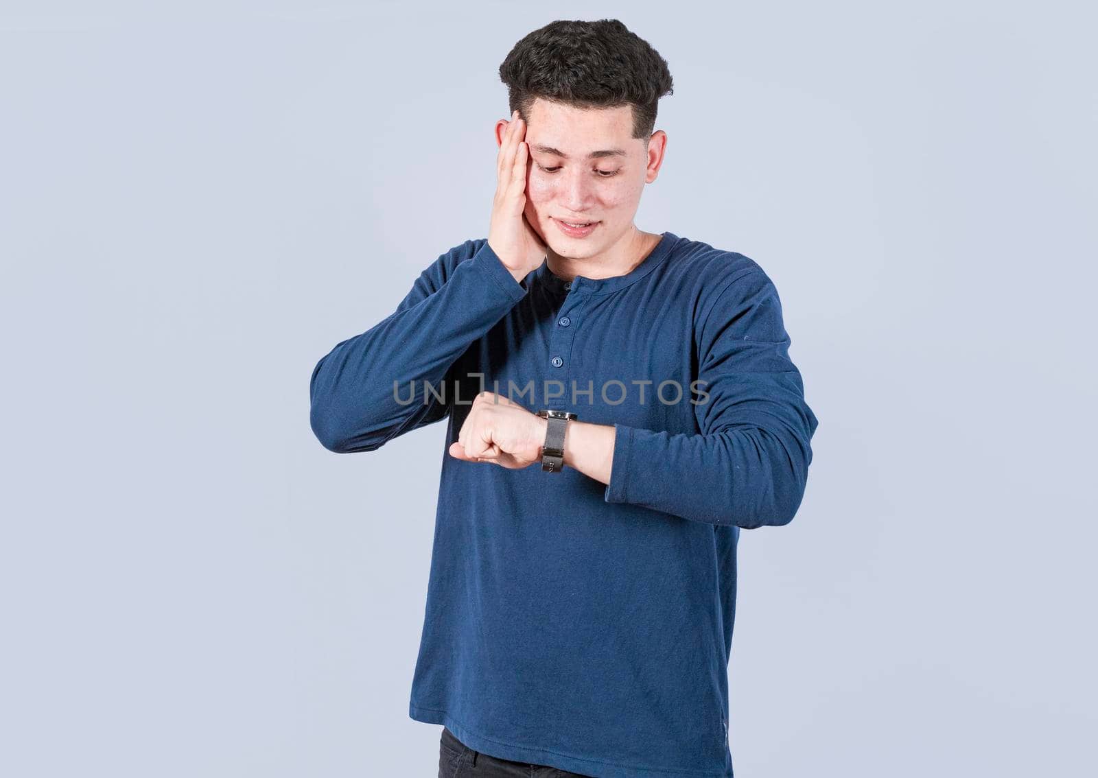 Young man looking at the watch time worried, worried young man looking at the watch, A man looking at the watch time worried