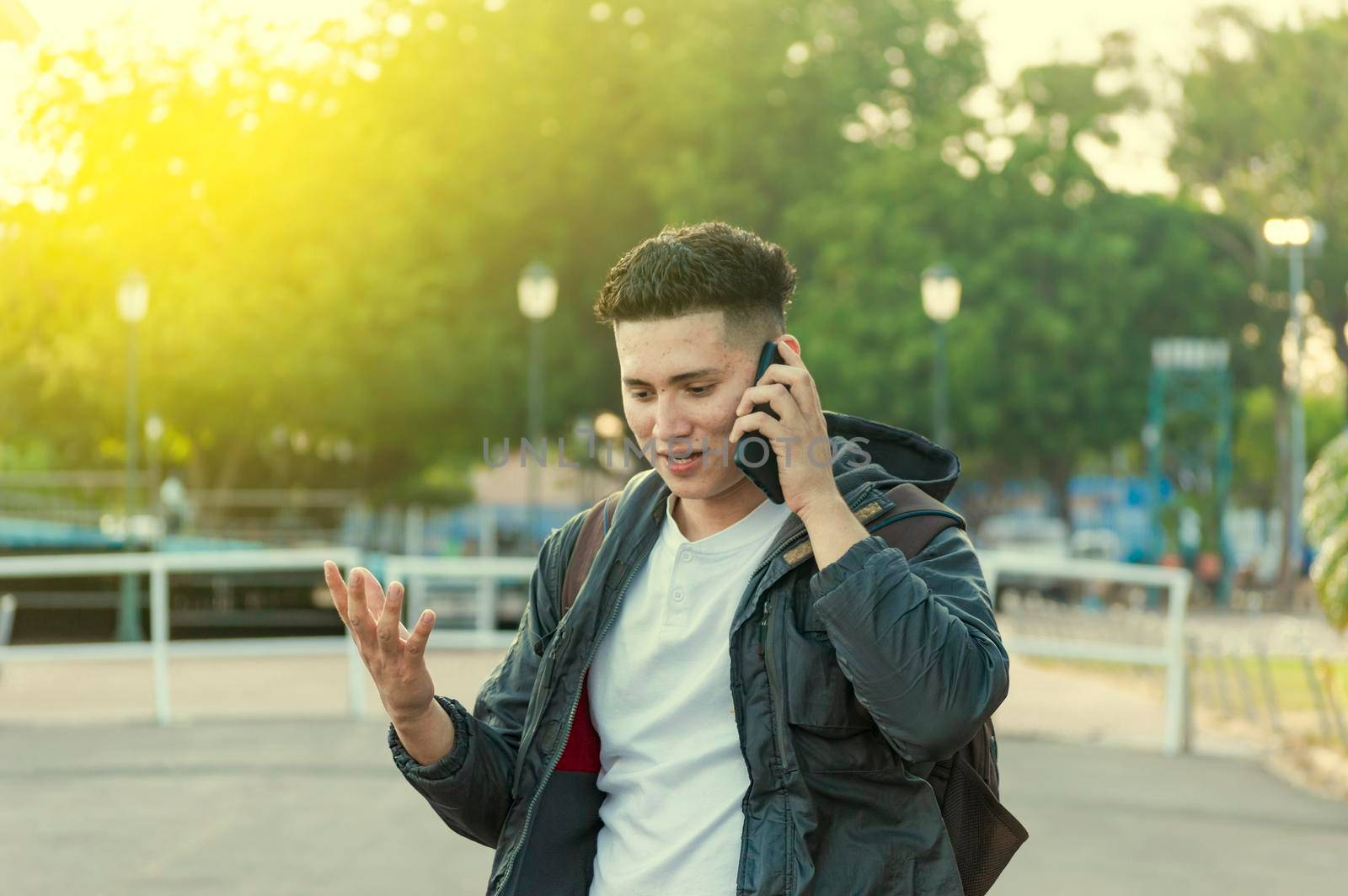 Man calling on the phone, young man calling on cell phone, latin guy calling on the phone