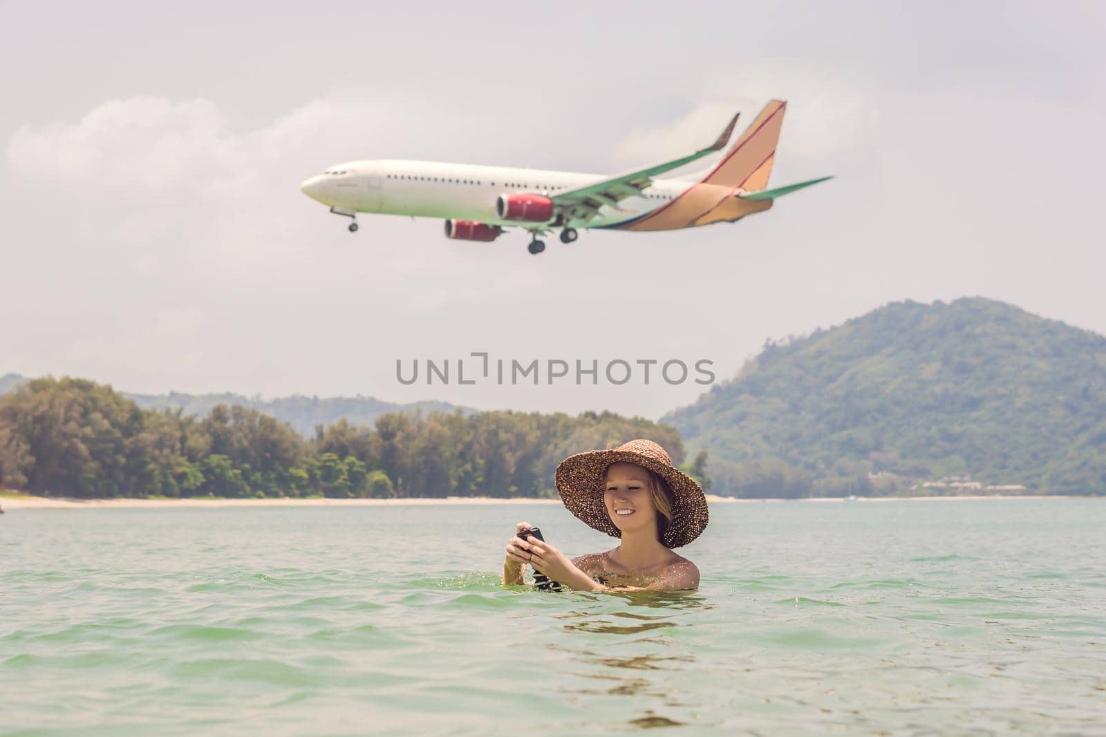 Coronavirus is over. Quarantine weakened. Take off the mask. Now you can travel. Young woman on the beach and landing planes. Travel concept.