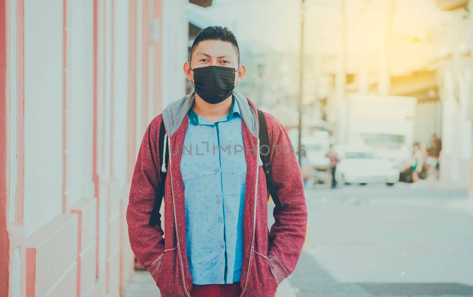 Portrait of a man in the street with a mask, portrait of a young Latino man with a mask in the street by isaiphoto