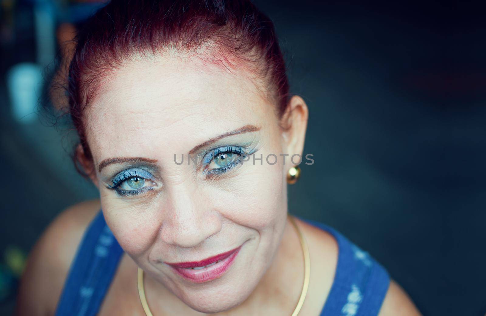 Natural portrait of a latin girl with blue eyes, portrait of a smiling latin woman with blue eyes