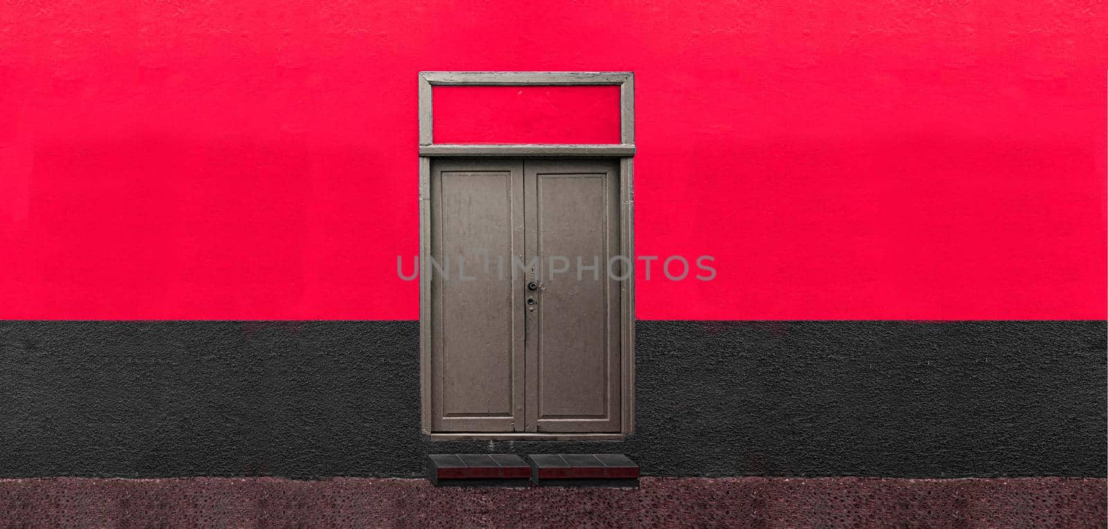 wooden door on red wall, door details on colored wall by isaiphoto