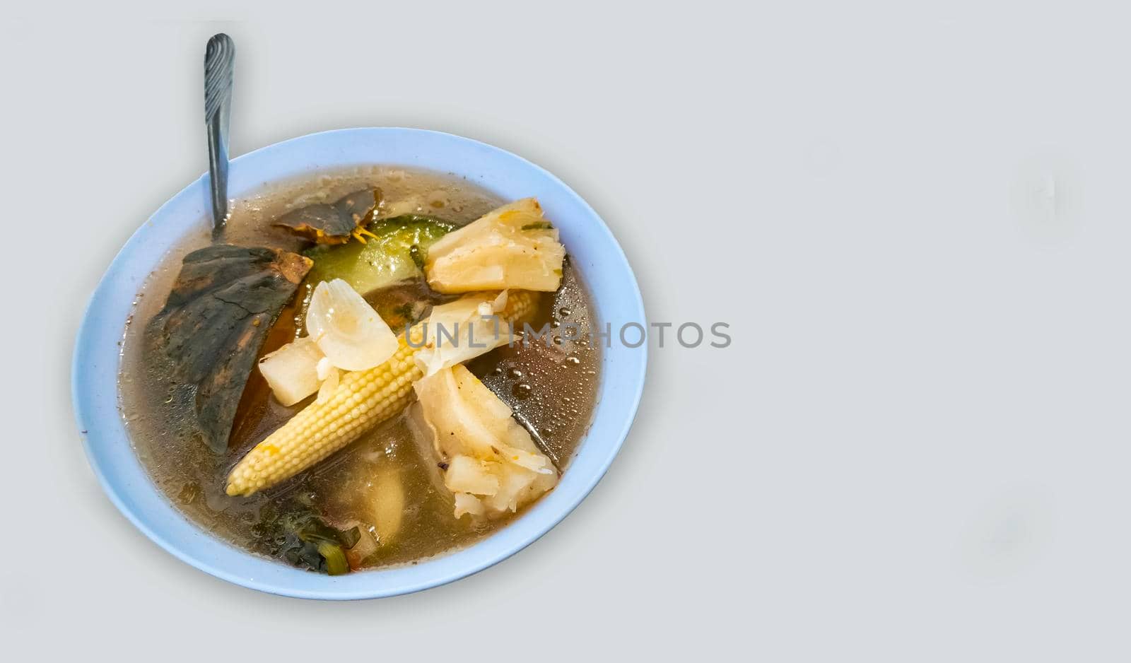 Beef soup on white background with copy space, One cup beef broth