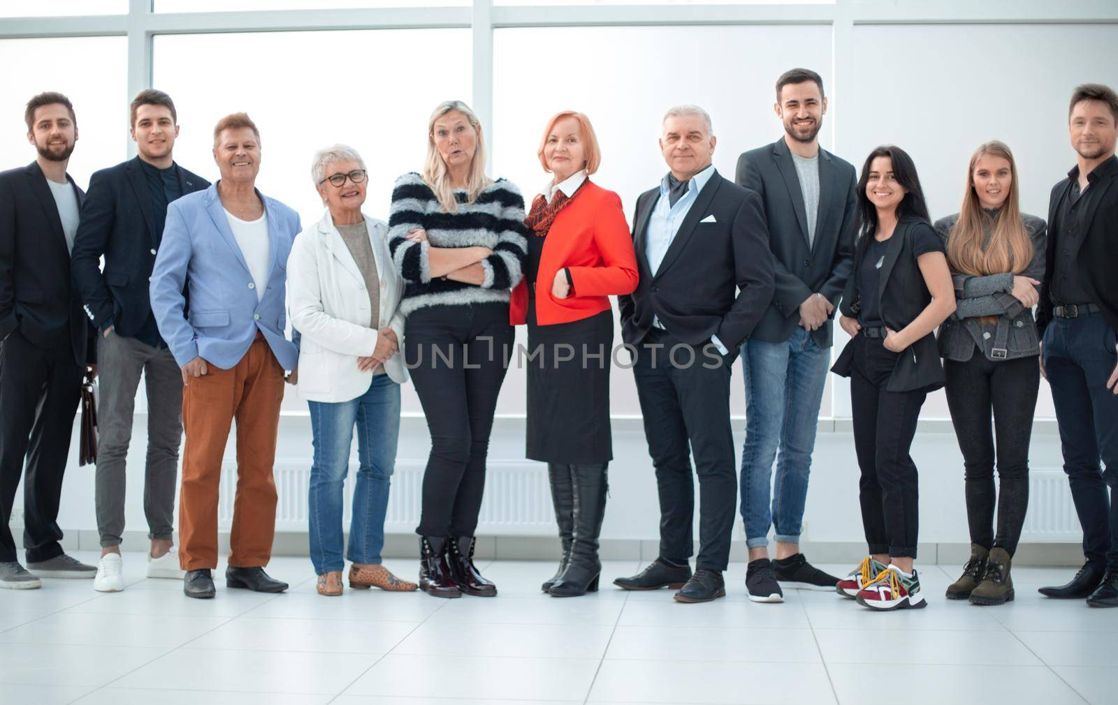 Group of business people in an office lined up. Team work concept