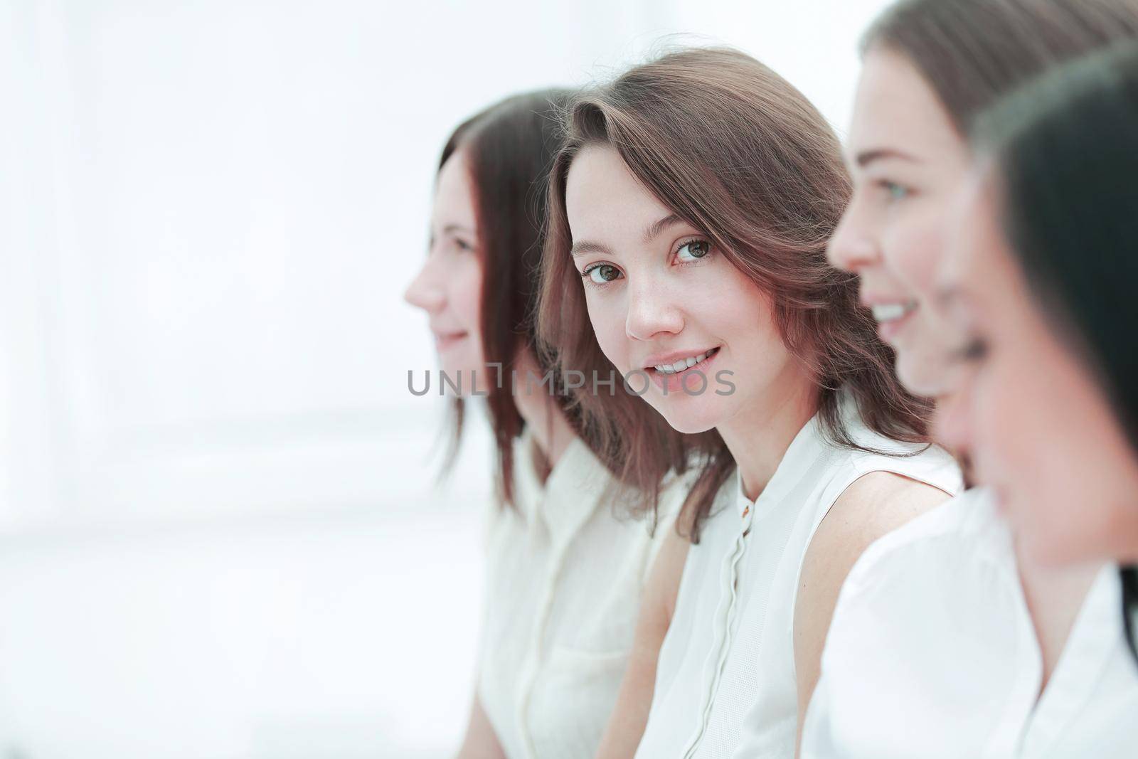 close up.young business woman on the background of colleagues.