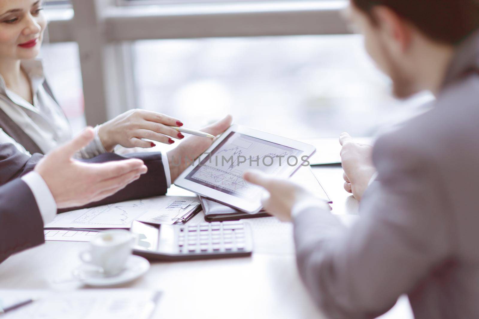 group of business people talking at the table by SmartPhotoLab