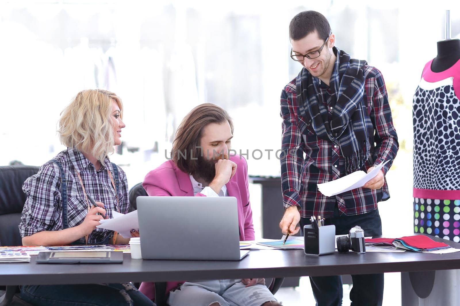 team of designers discussing new ideas in the Studio by SmartPhotoLab