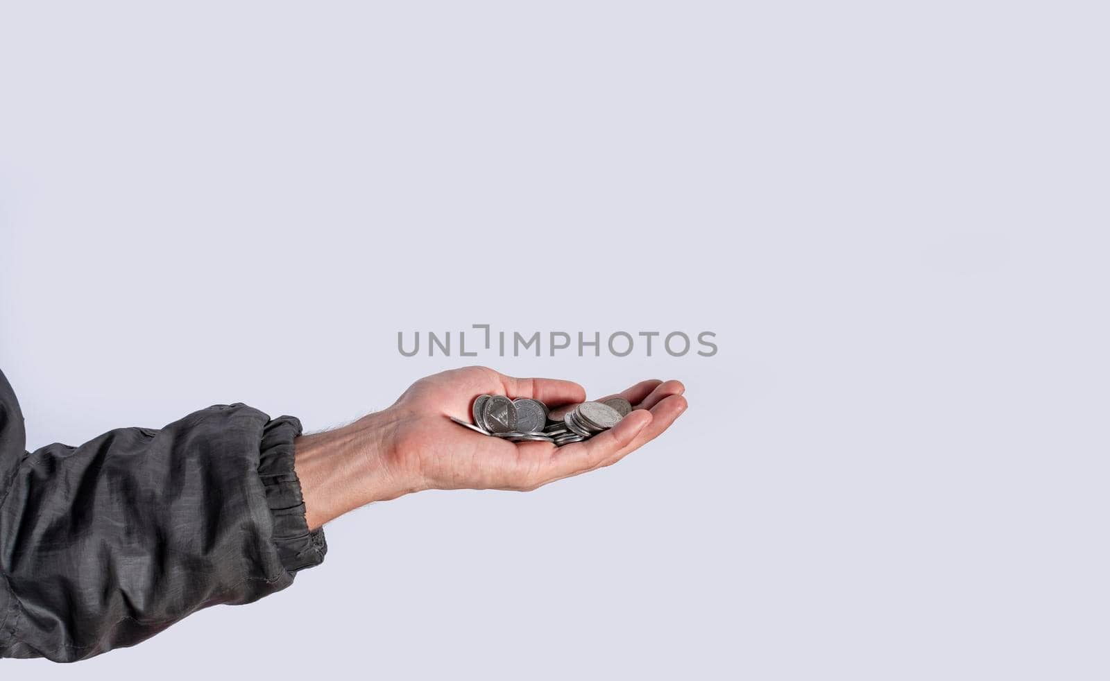 Hands with several coins in isolated background, Close up of hand with several coins, currency savings concept