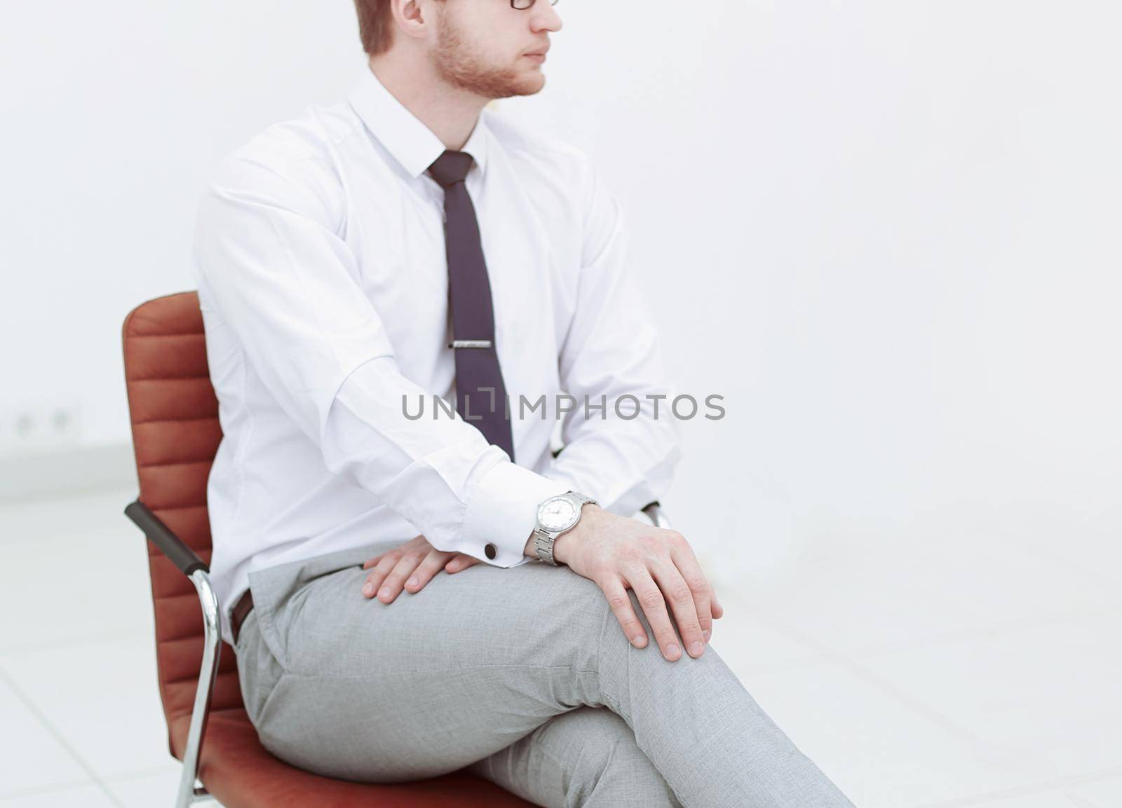 serious young businessman sitting in office chair.photo with copy space