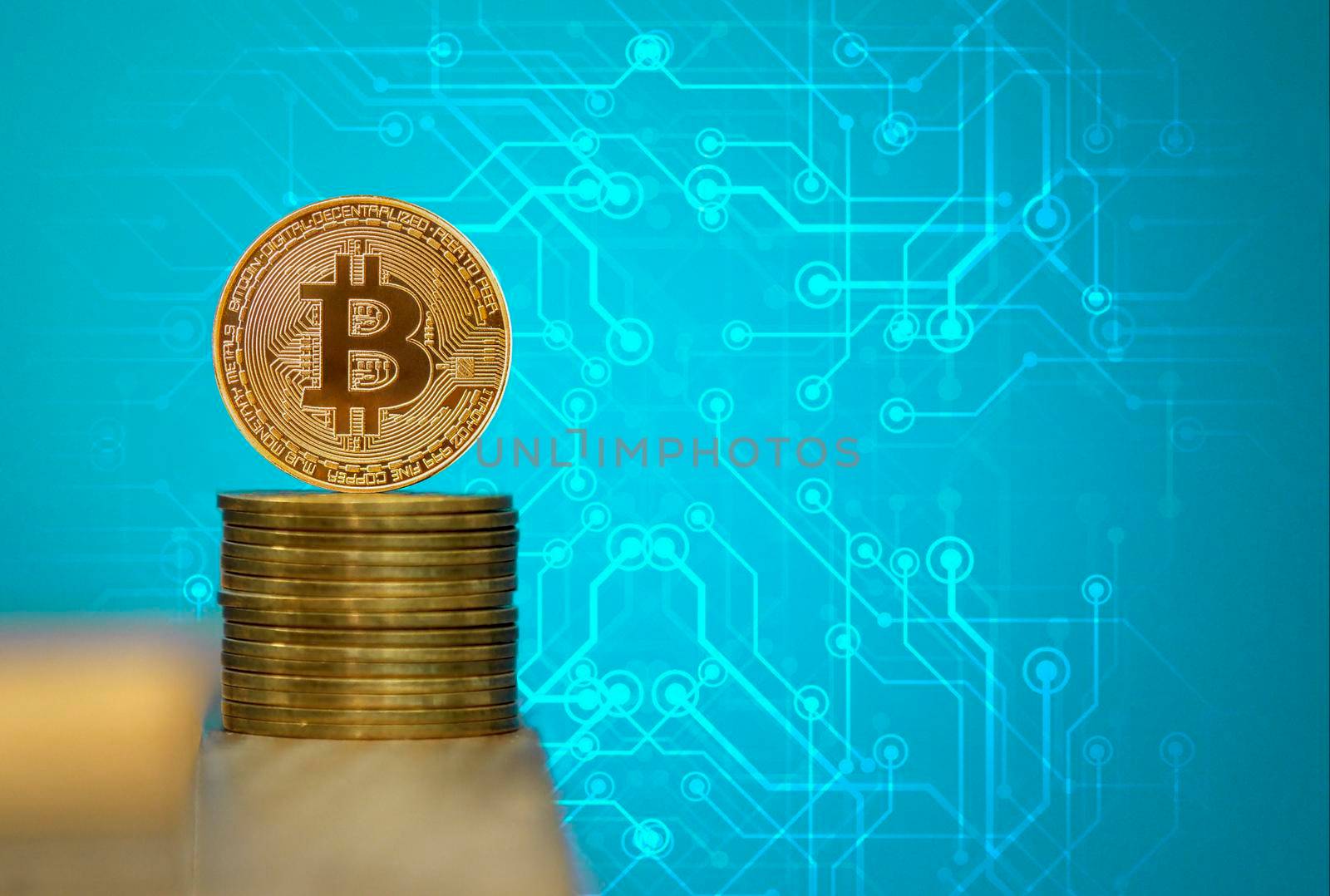 Bitcoin coins with blue background, one gold bitcoin on blue background by isaiphoto