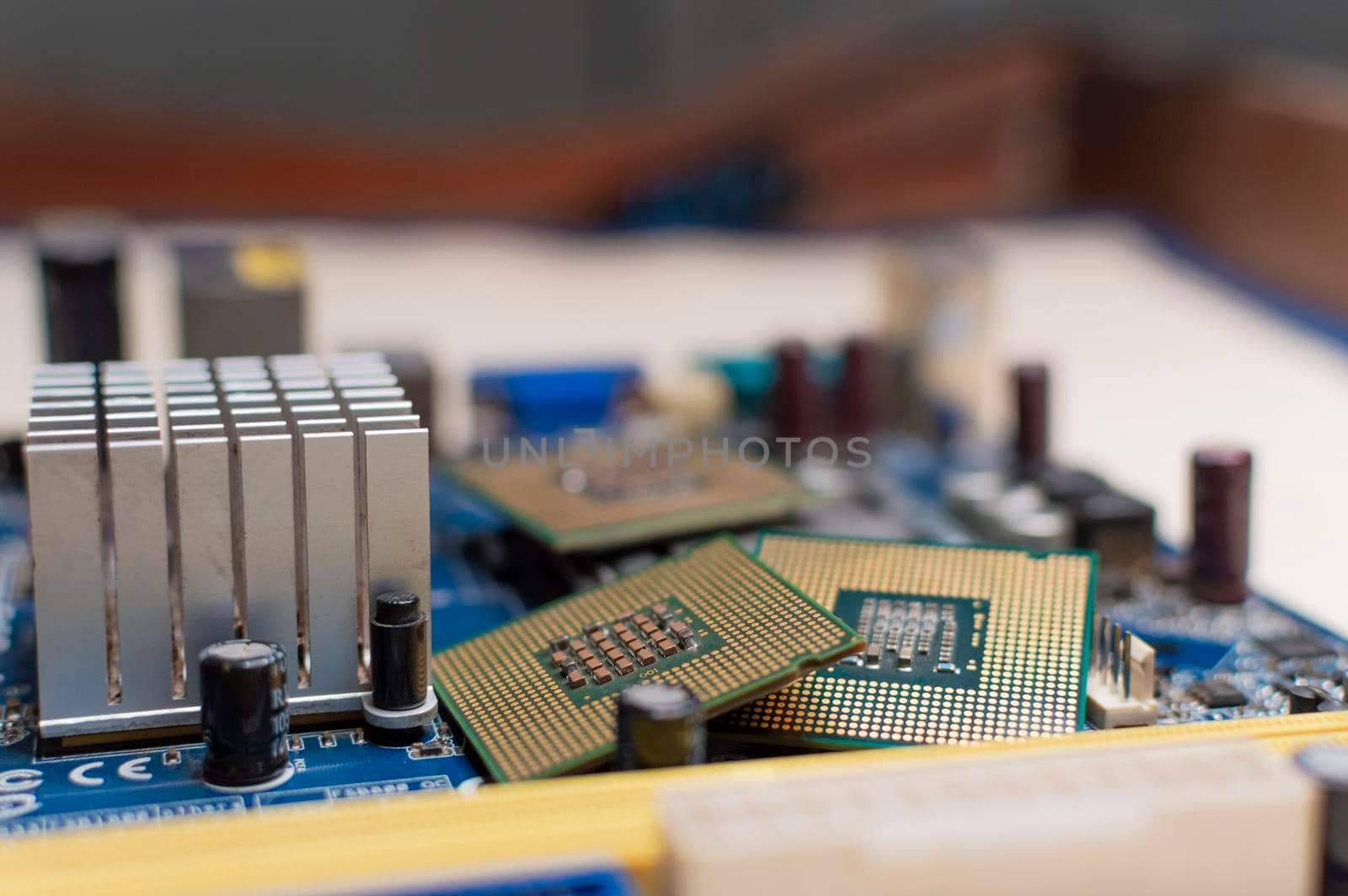 Close up of a motherboard, details of a computer motherboard, detail of a motherboard socket, three processors on a computer motherboard