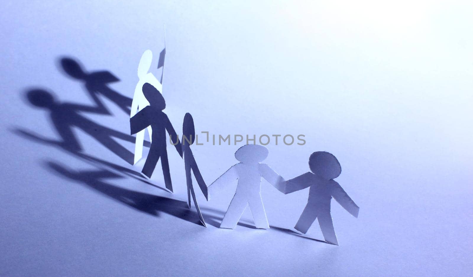 Paper people doing teamwork in their business