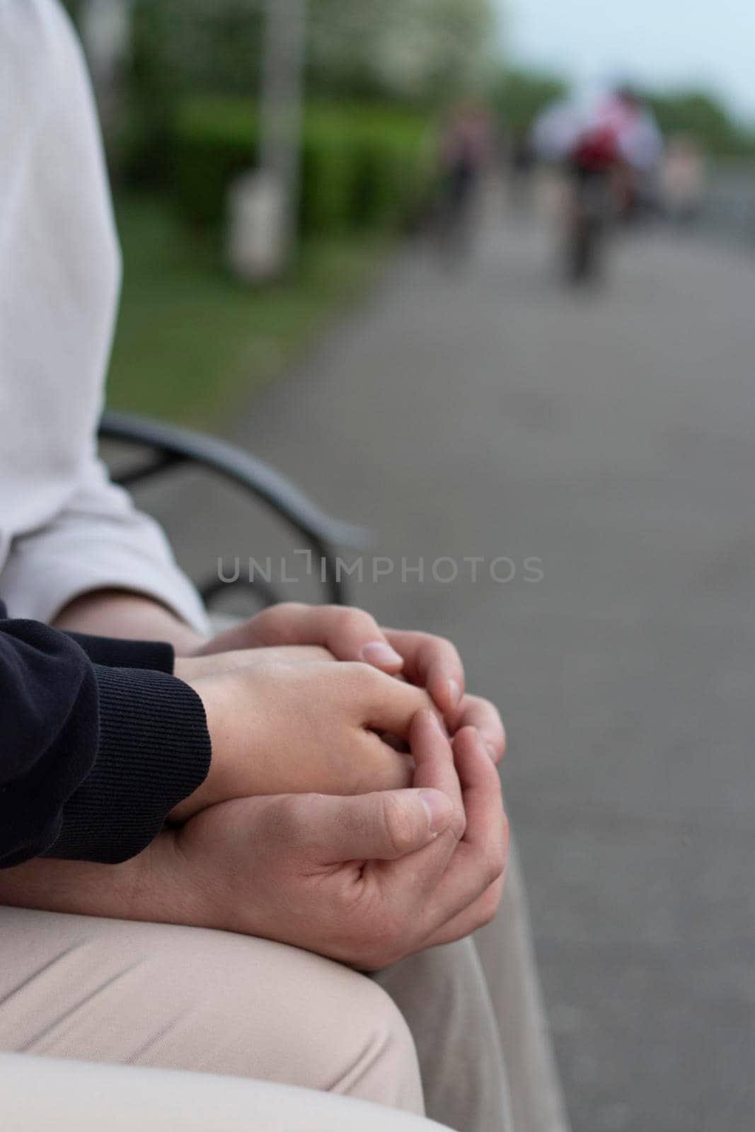 love concept - close up of engaged couple holding hands with ring by AleksandraLevkovskaya