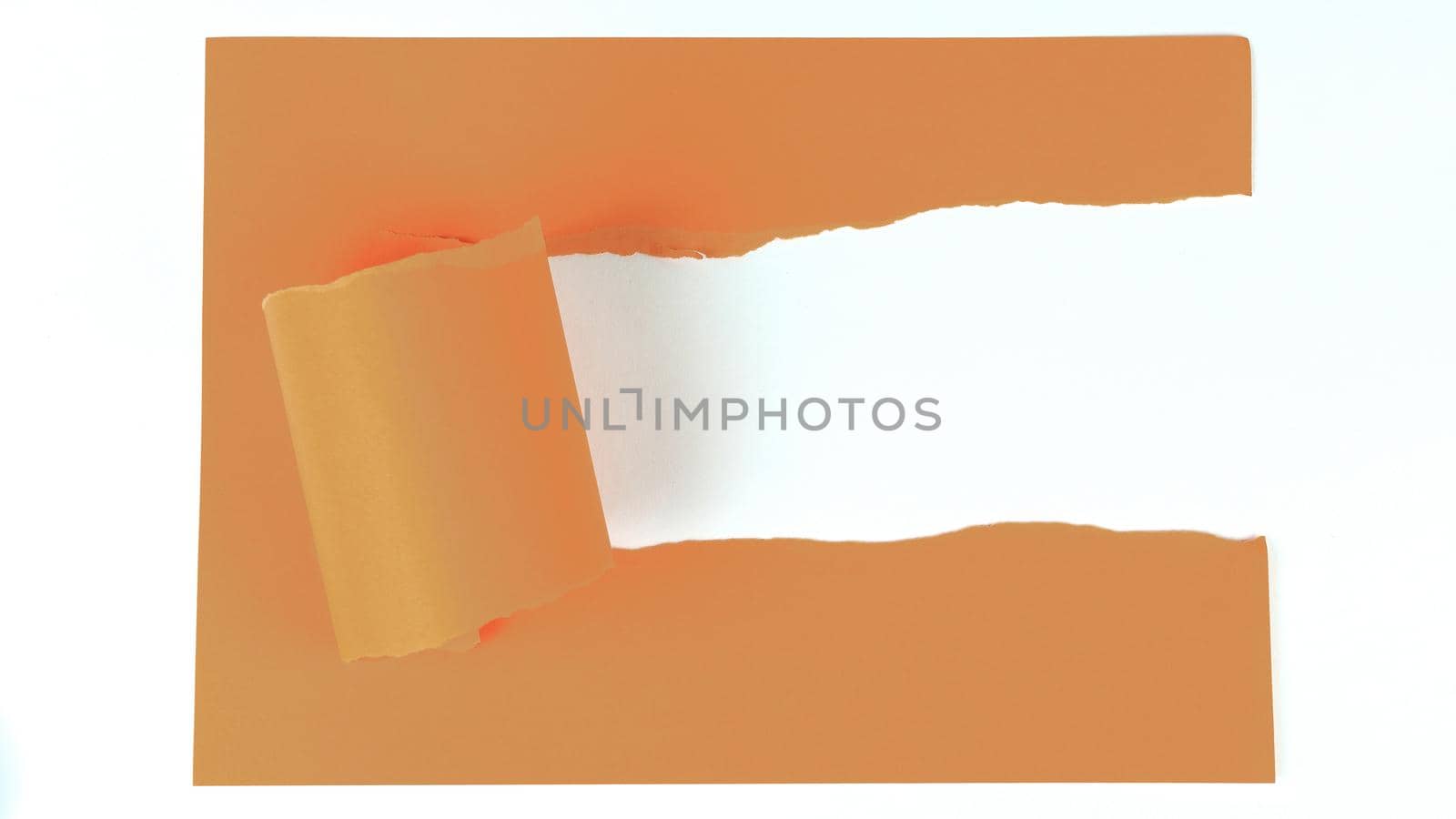 orange torn sheet on a white background.photo with copy space