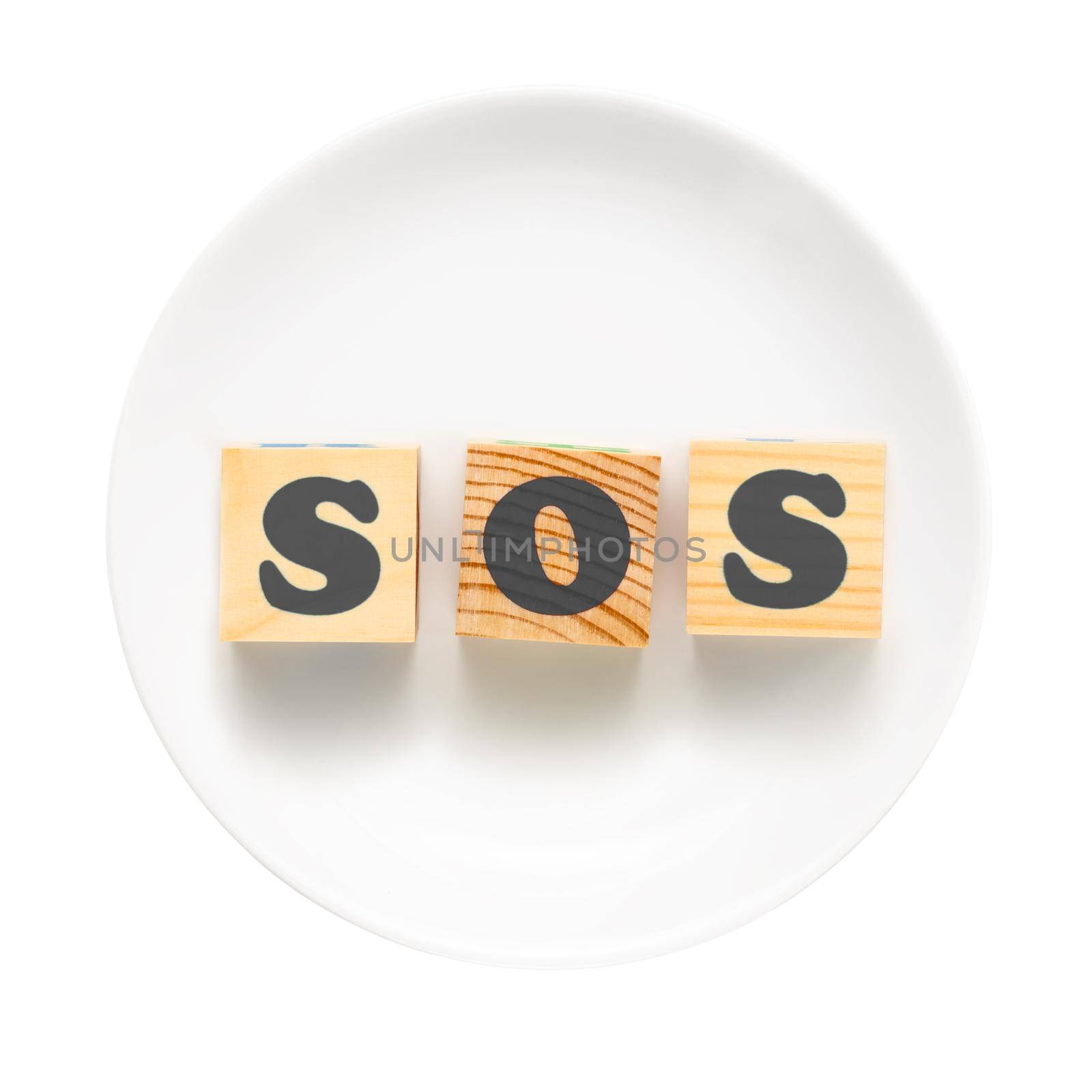 White plate with sign SOS composed of wooden blocks. Bad food concept - isolated on a white background.