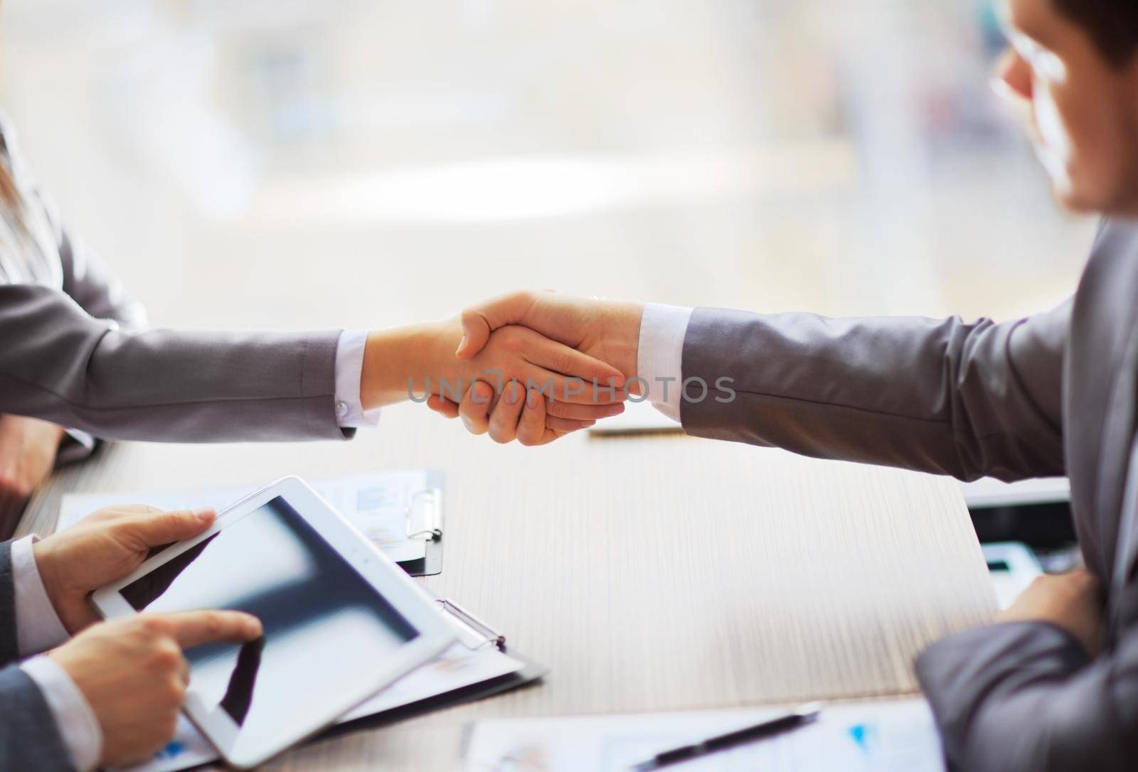 Business people shaking hands, finishing up a meeting