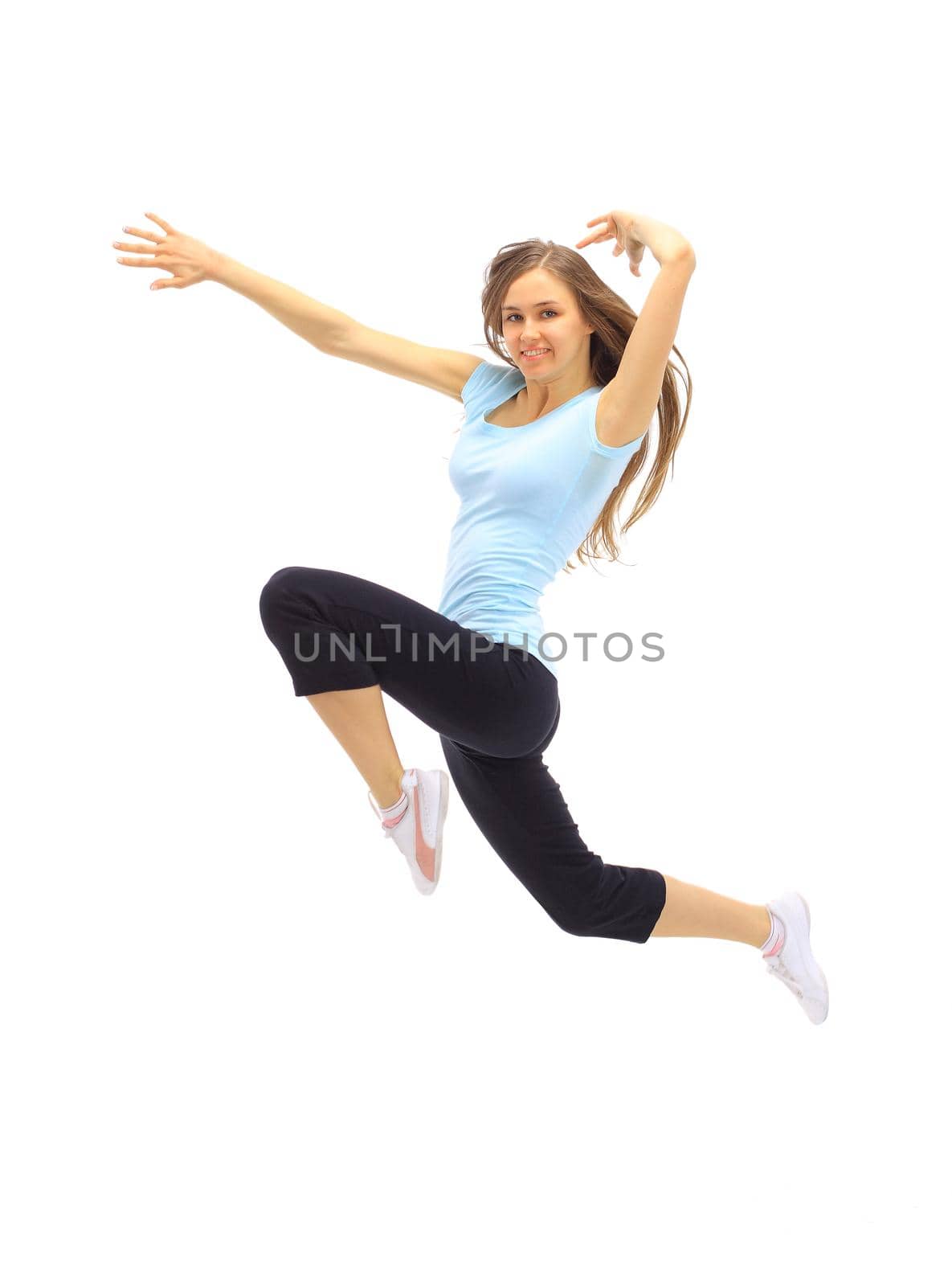 The beautiful young woman plays sports on a white background by SmartPhotoLab