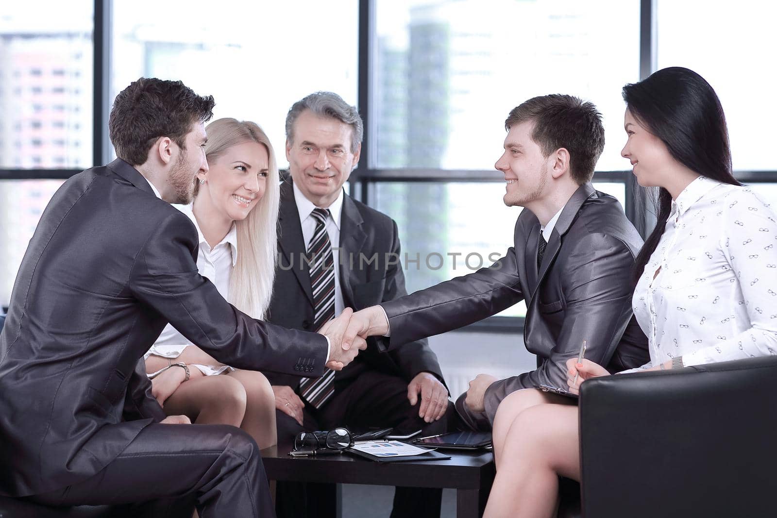 handshake of business partners at the working meeting .the concept of cooperation