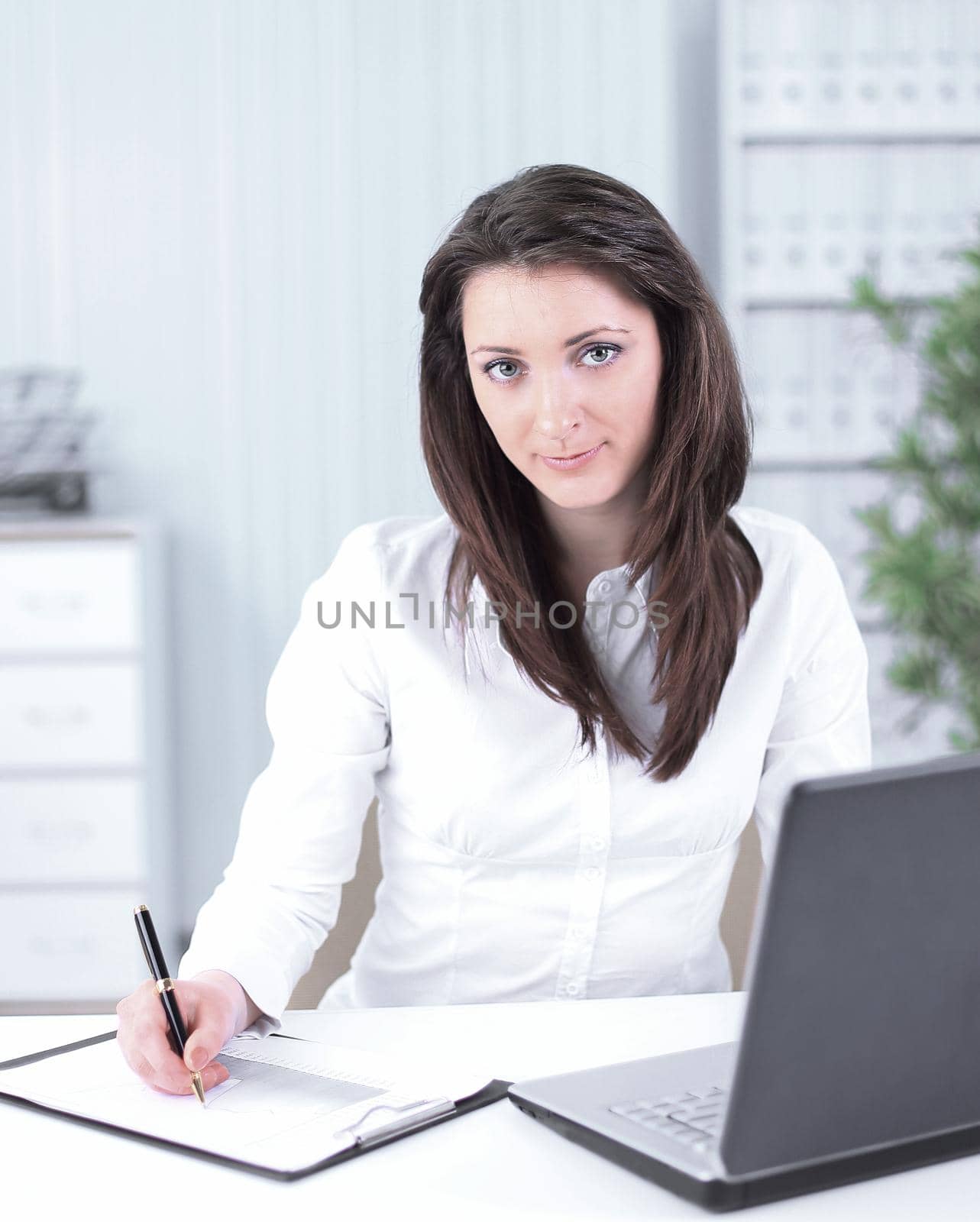 business woman analyzing the financial schedule. photo with copy space by SmartPhotoLab