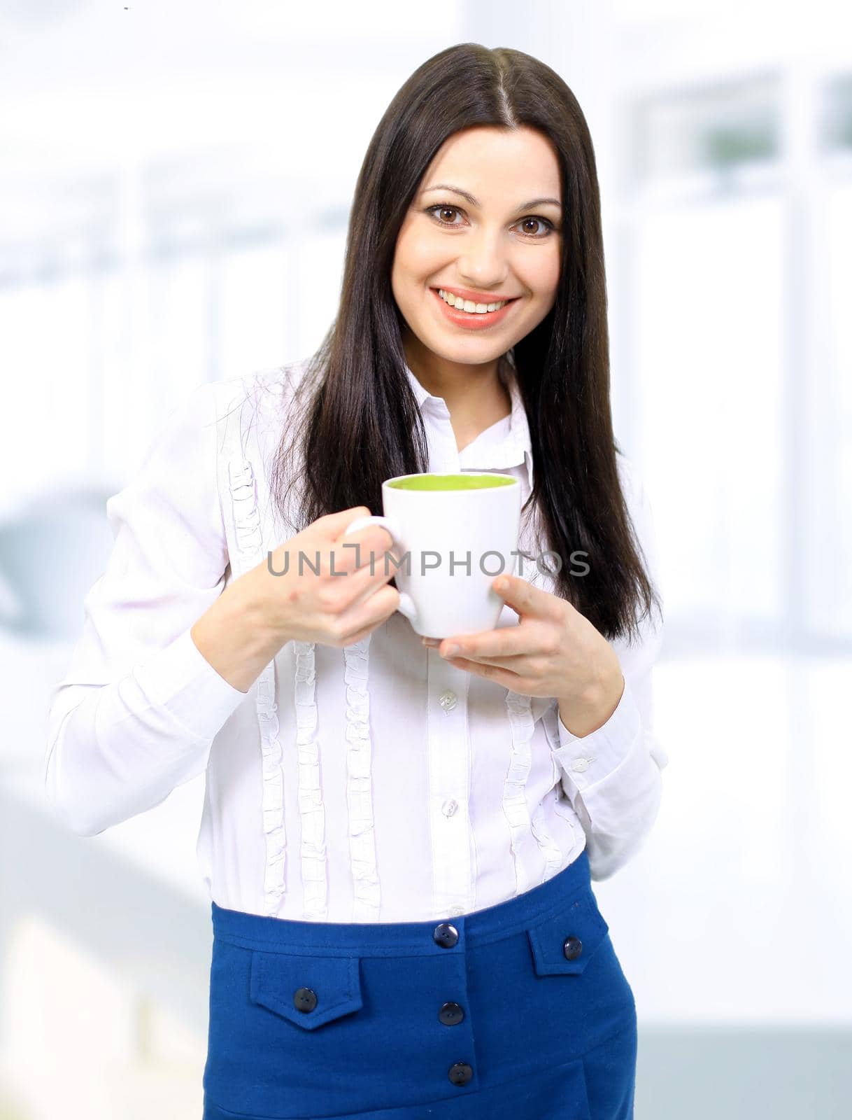 Portrait of beautiful business woman holding coffee cup
