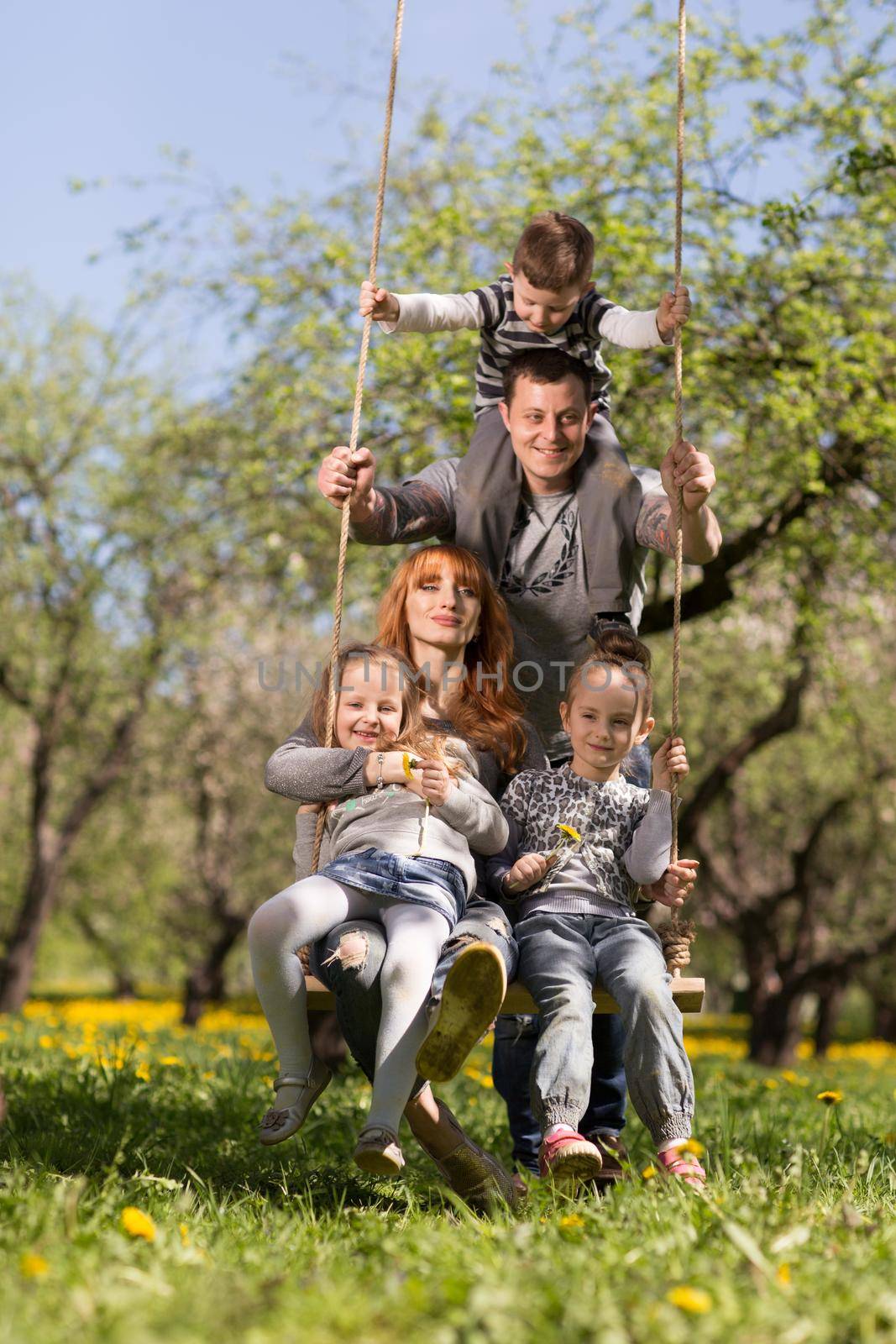 Riendly, cheerful family having a picnic.