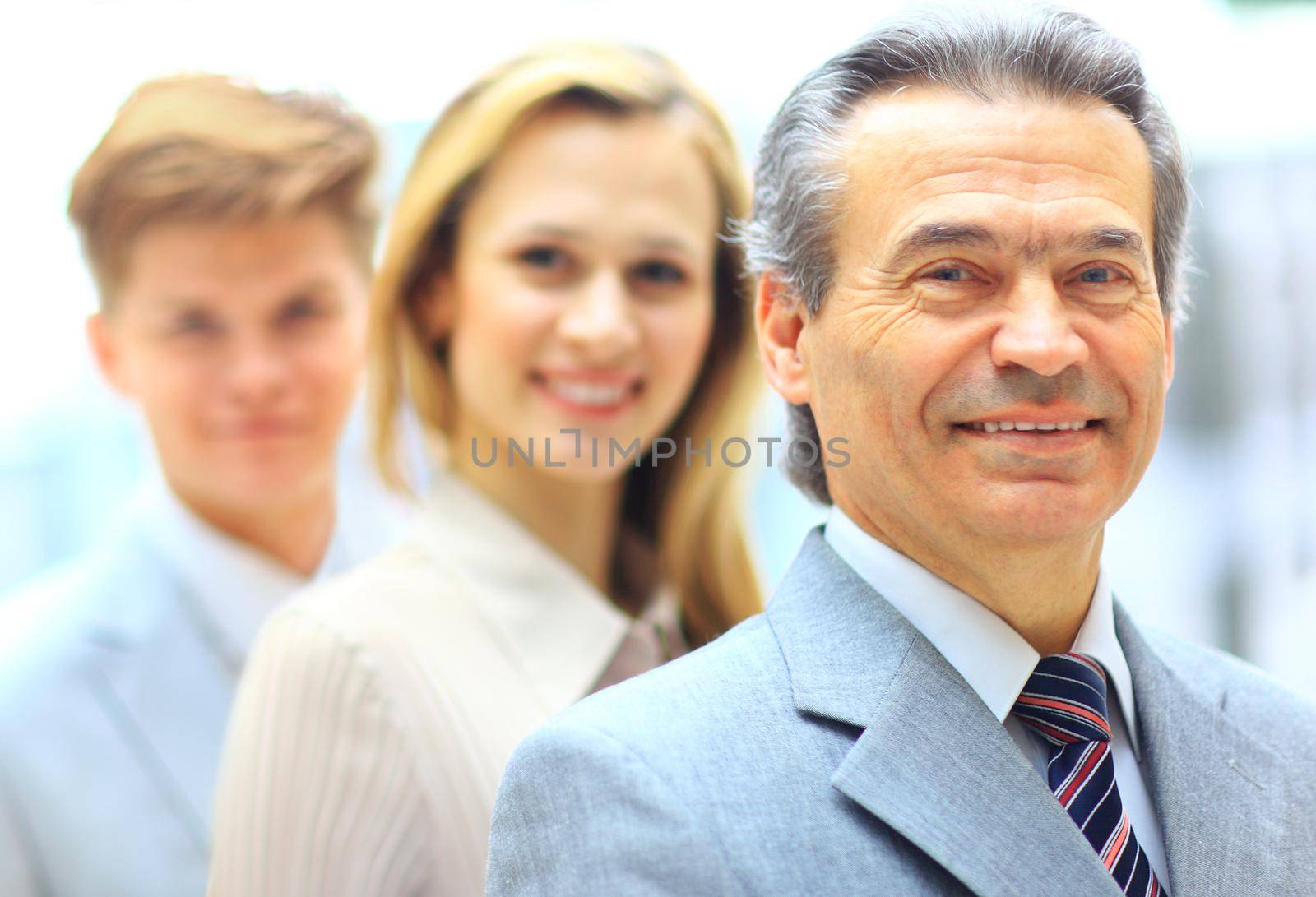 Group portrait of a professional business team looking confidently at camera