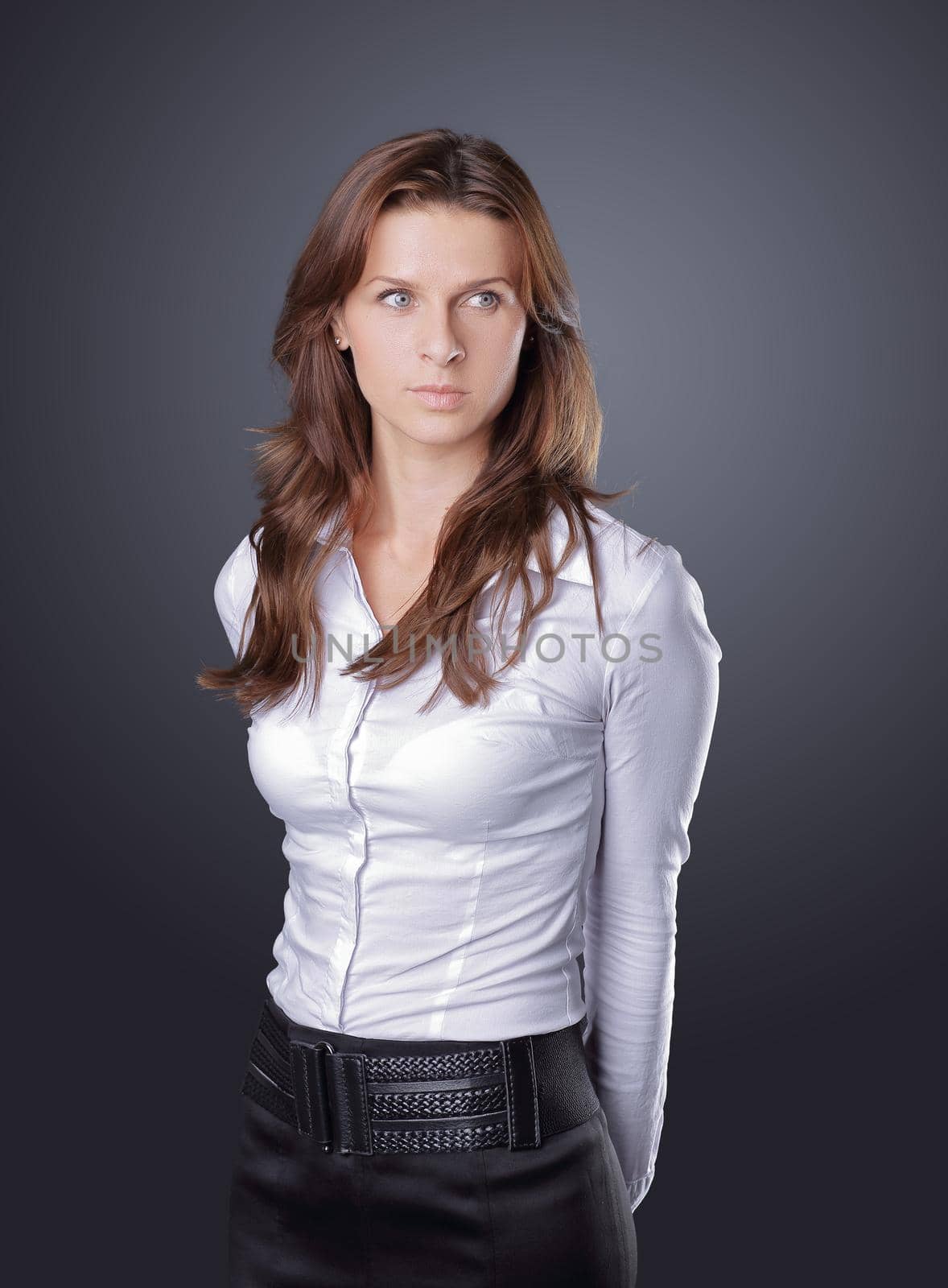 confident young business woman.isolated on dark background by SmartPhotoLab
