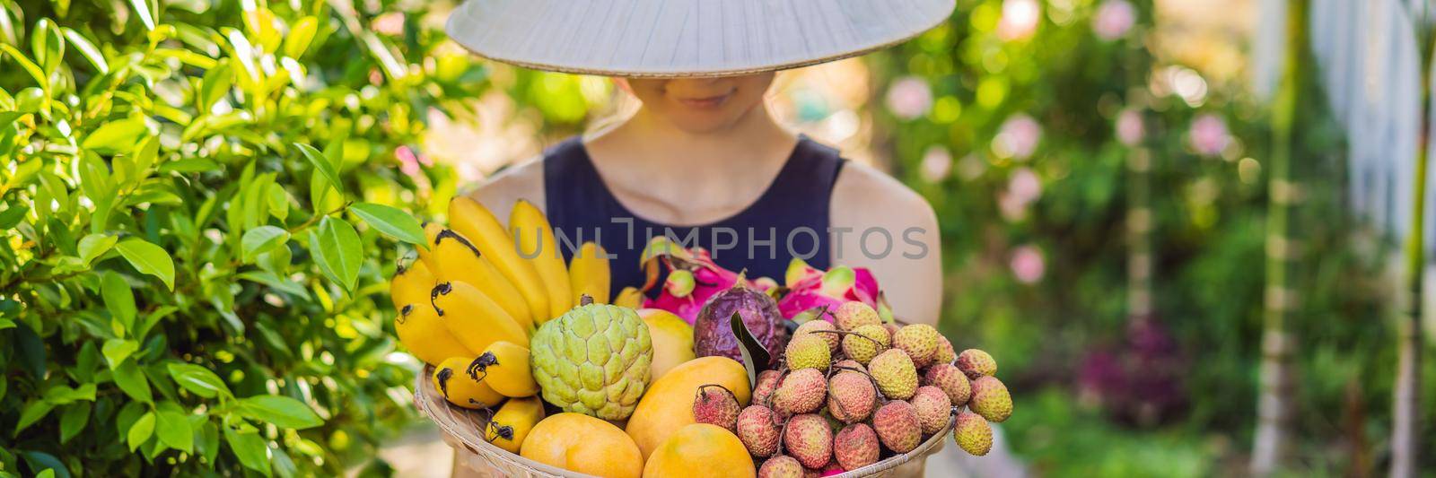Variety of fruits in a Vietnamese hat. Woman in a Vietnamese hat. BANNER, LONG FORMAT