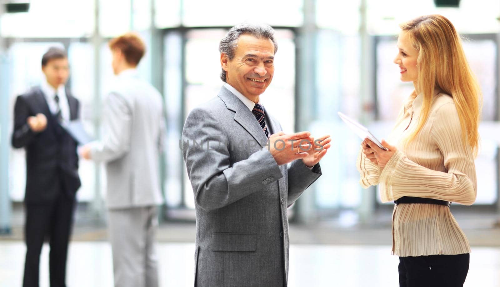 Business people using a digital tablet