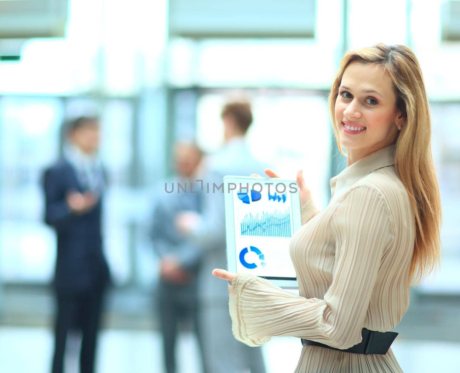 Handsome businesswoman using his digital tablet