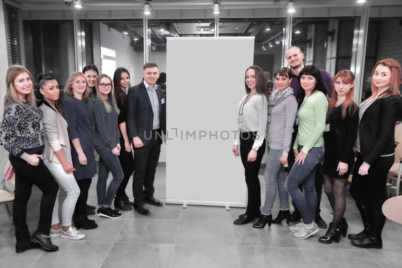 group of participants of the workshop standing in the lobby of the conference hall.photo with copy space