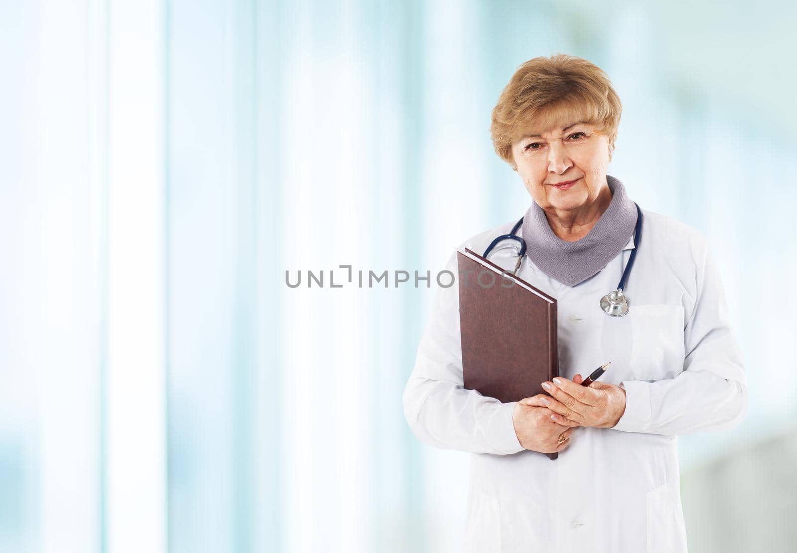 Medical physician doctor woman over blue clinic background