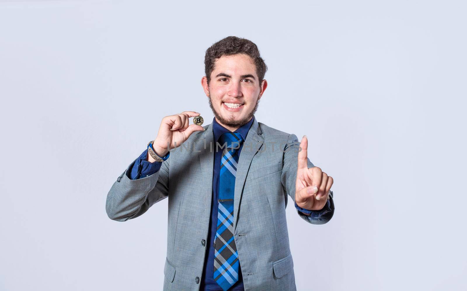 isolated business man showing a bitcoin coin, man in a suit with a bitcoin pointing, business man looking at his watch and pointing up