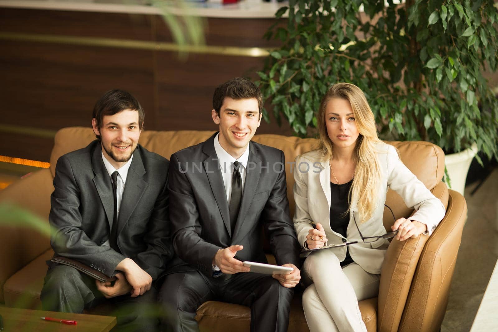 A group of successful businessmen. Discussion of the important contract of the company.