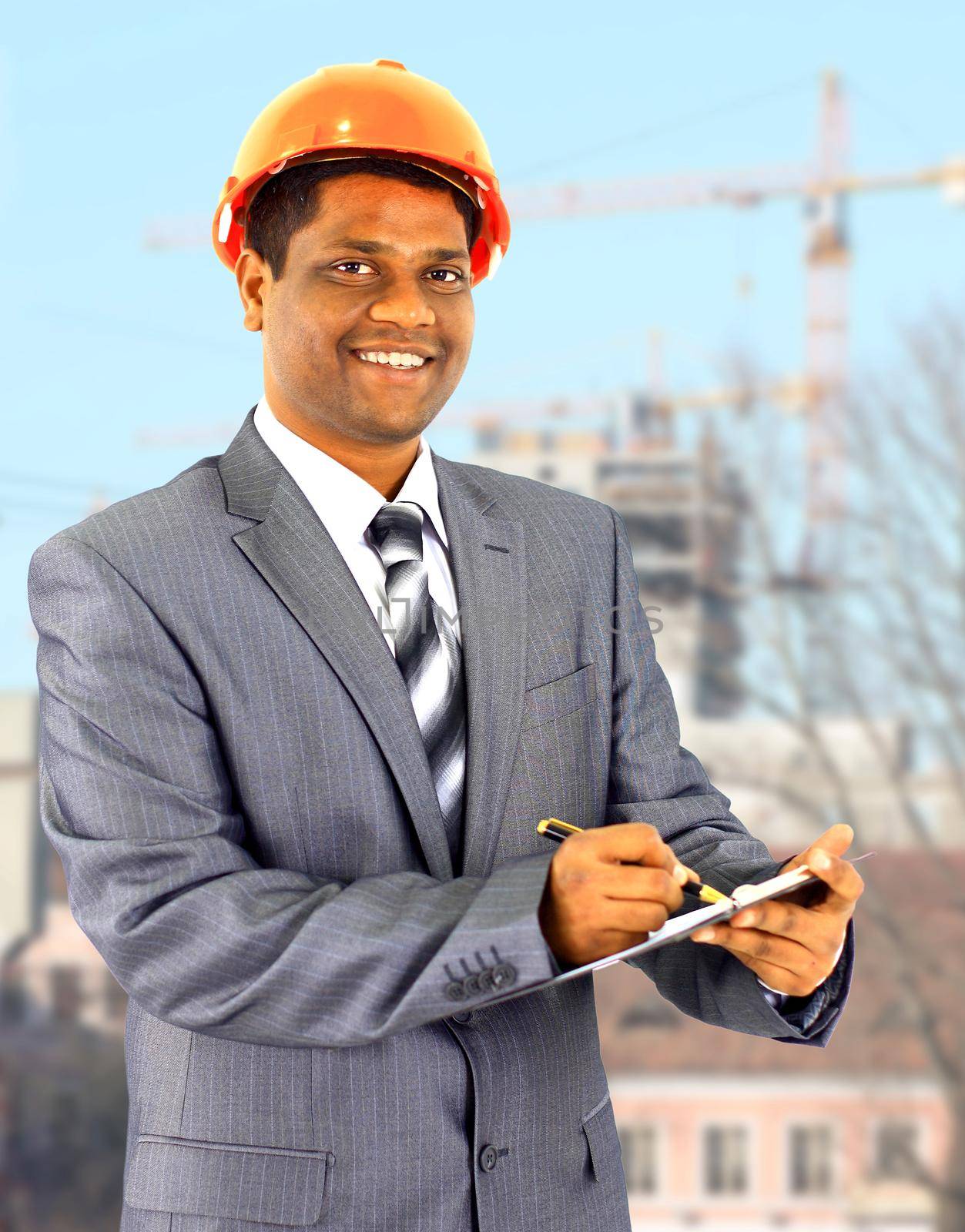 A male construction worker a job site. by SmartPhotoLab