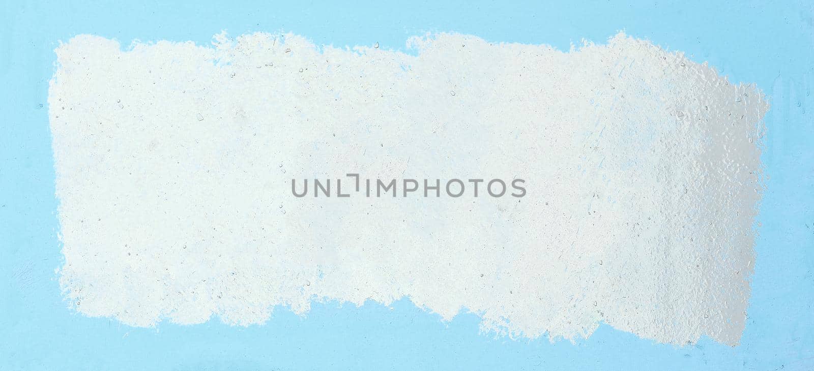 painted white frame on a blue background. photo with copy space.