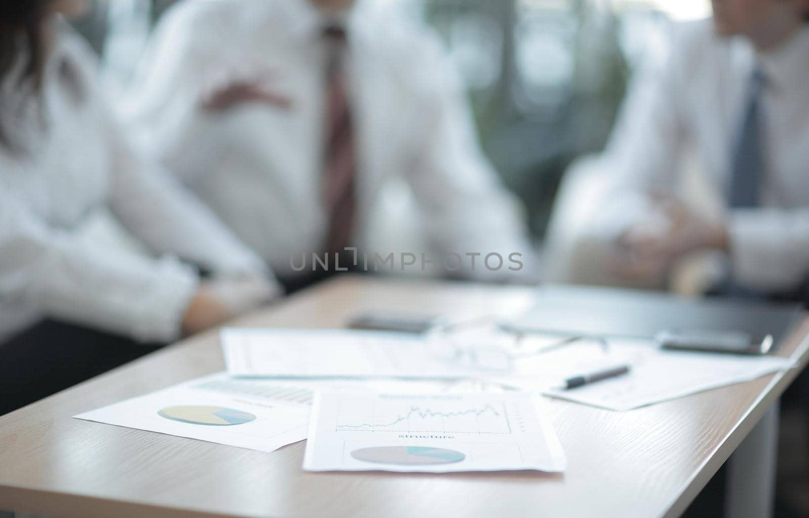 background image. closeup of a table with documents and business team.business background