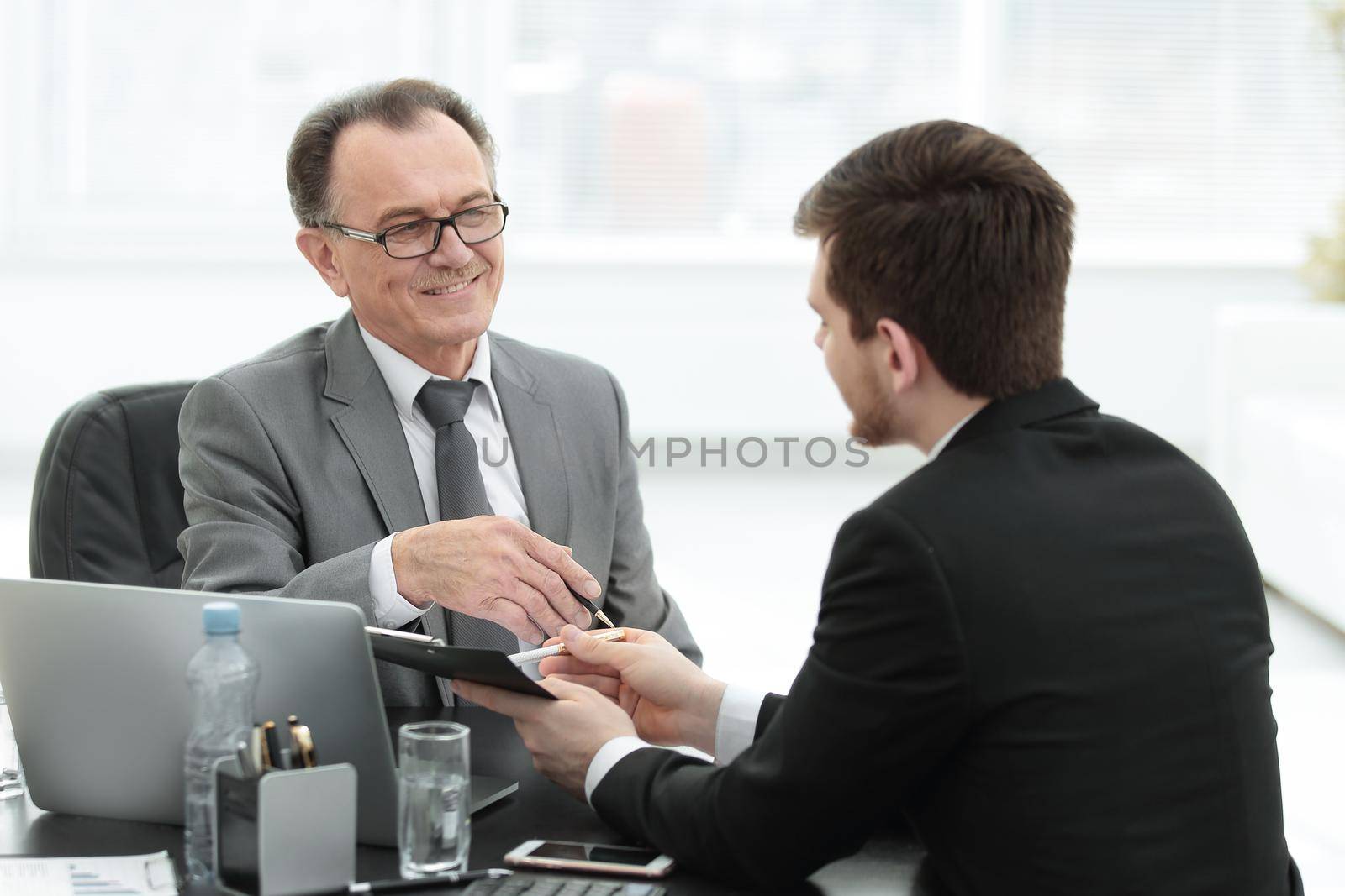 close up.business people talking at a Desk.meetings and partnership