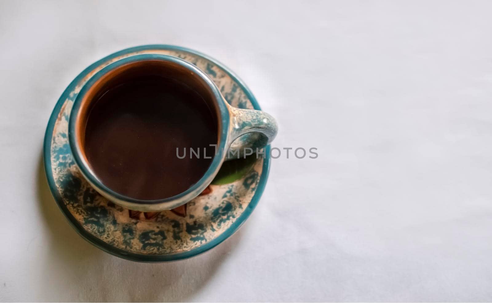 Photo of a cup with coffee on white background, cup of coffee with smoke on white background